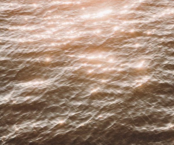 Abstract visual of light waves representing calm breathing.